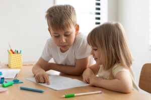 The,Older,Brother,Teaches,The,Younger,Sister,To,Read,Letters.