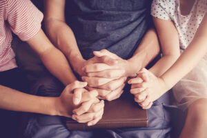 Children,Praying,With,Their,Father,Parent,At,Home,,Family,And