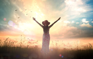 Praise,And,Worship,God,Concept:,Silhouette,Of,Healthy,Woman,Raised