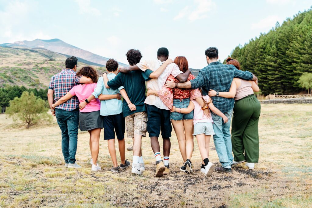 Rear,View,Of,A,Diverse,Group,Of,Young,Friends,Hugging